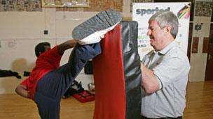 Sir Keith Mills at a kickboxing school supported by Sported