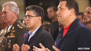 Venezuelan President Hugo Chavez attends Mass at the military academy in Caracas July 12