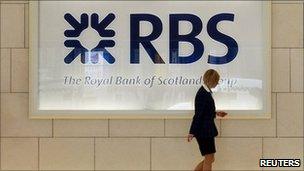 A worker in foyer of a Royal Bank of Scotland office in London