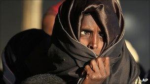 A Somali woman waits to register at Dagahaley Camp, outside Dadaab, Kenya (13 July 2011