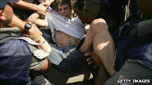 Teenager from Jewish settlement in Gaza is forcibly removed by police in 2005.
