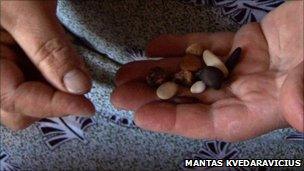 Fortune teller holding stones