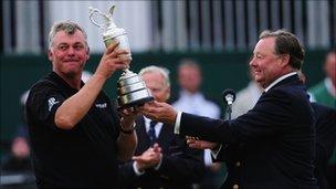 Darren Clarke is presented with the Claret Jug