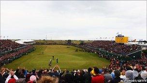 Darren Clarke of Northern Ireland celebrates victory on the 18th green during the final round of The 140th Open Championship at Royal St George's