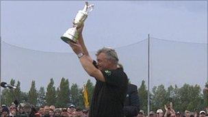 Darren Clarke lifts the Open trophy on Sunday