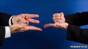 Rock-paper-scissors players (Thinkstock)