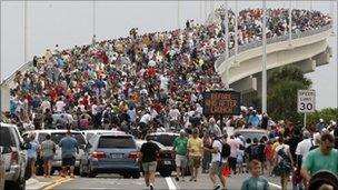 Spectators line the A.Max Brewer bridge in anticipation of the launch of the space shuttle Atlantis in Titusville