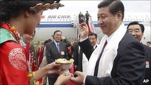 Chinese Vice President Xi Jinping, right, is welcomed upon his arrival in Lhasa, July 17, 2011