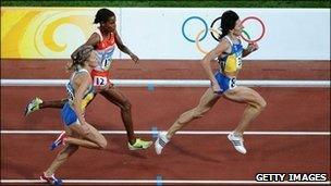 Ukraine's Iryna Lishchynska runs ahead of Bahrain's Maryam Jamal (C) and fellow countrywoman Nataliya Tobias during the women's 1500m final at the National stadium in Beijing in 2008