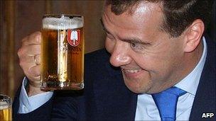 Russian President Dmitry Medvedev raises a glass with German Chancellor Angela Merkel (file image)