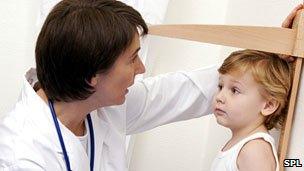 Measuring a young boy's height