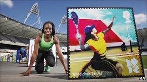 Jeanette Kwakye with an image of one of the stamps