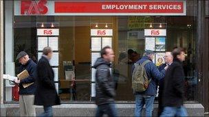 People walk past a recruitment office in Ireland