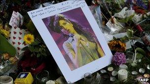 Flowers, pictures and messages are left in tribute to Amy Winehouse