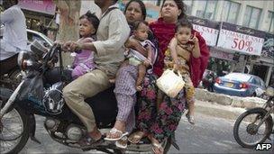 Six people on a motorcycle in Karachi