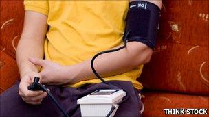 A man measuring blood pressure