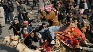 Pro and anti-Mubarak forces clash in Tahrir Square