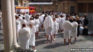 Spa customers in bathrobes - Baris Yalabik