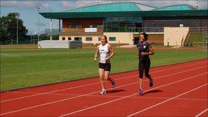 Dame Kelly Holmes & Surrey athlete Dani Christmas on the running track at Tonbridge School