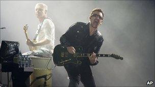 Bono, right, and Adam Clayton, from the rock group U2