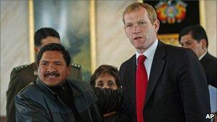 British Minister for Latin America, Jeremy Browne (right) shakes hands with Felipe Caceres, Bolivian Minister of Social Defence, at a news conference at the Bolivian Police Academy in La Paz, Bolivia, on 27 July 2011