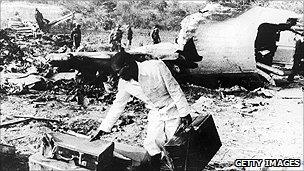 Men sift through the wreckage of an Air Rhodesia Viscount shot down by a terrorist missile in 1978