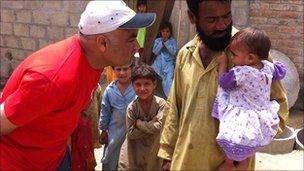 Habib Malik with Khatija, who was born during the floods