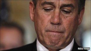 US House Speaker John Boehner talks to the press on Capitol Hill on 25 July 2011