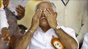 India"s opposition Bharatiya Janata Party (BJP) leader and southern state of Karnataka"s Chief Minister B.S. Yeddyurappa reacts during a function organized to felicitate him before he submitted his resignation to the state governor in Bangalore, India, Sunday, July 31, 2011