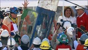 Miner Samuel Avalos waves after being winched to safety