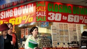 People walk past a shop in Melbourne