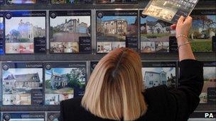 Woman looking at houses for sale