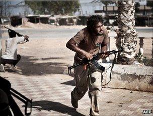 Libyan rebels come under fire just beyond Bir al-Ghanam, 6 August