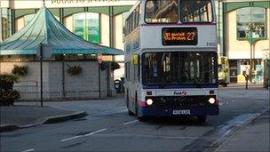 A bus pulling out of Truro bus station early in the morning