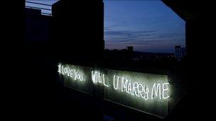 Neon lights of the graffiti 'I Love You Will U Marry Me'