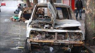 A burnt out car in Grove Lane