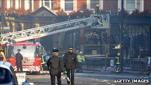 Police and fire officers on street after riots