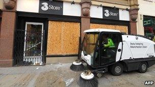 Boarded-up shop in Manchester