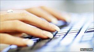 Woman typing on computer