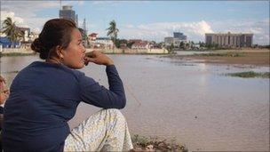 Residents look out at Boeung Kak lake