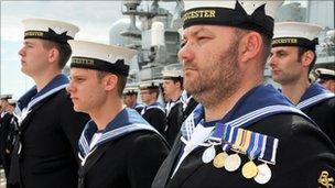 Servicemen during the decommissioning ceremony for the HMS Gloucester in Portsmouth