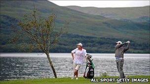 Rory McIlroy and caddy