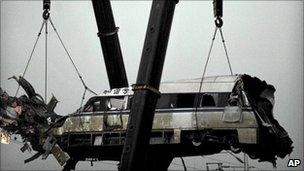 Train lifted from wreckage