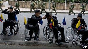 Soldiers wounded in the line of duty prepare for the military parade marking the 201st anniversary of Colombia's independence from Spain,