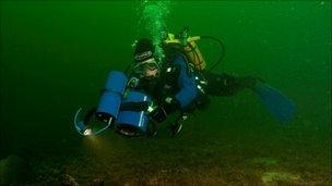 Diver surveying