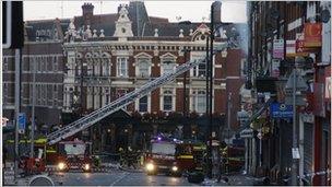 Firefighters dampen down after blaze in centre of Clapham Junction