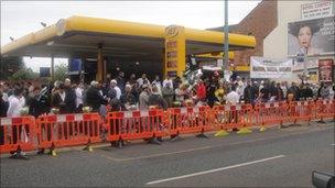 People gather for Friday prayers at Dudley Road Mosque, close to where the three men were killed.