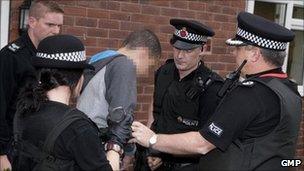 Rioter being arrested by GMP