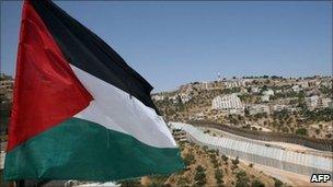 Palestinian flag in front of the separation barrier near Bethlehem, West Bank (July 2011)