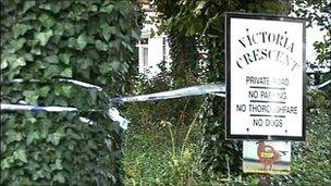 Police tape around the Victoria Crescent sign